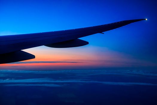Australian sunset below the wing of an airplane