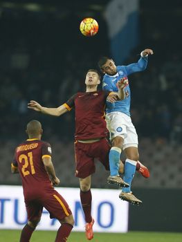 ITALY, Naples: Faouzi Ghoulam (right) of SSC Napoli competes for the ball against Edin Dzeko (centre) of AS Roma during a Serie A match at Stadio San Paolo in Naples, Italy on December 13, 2015. 