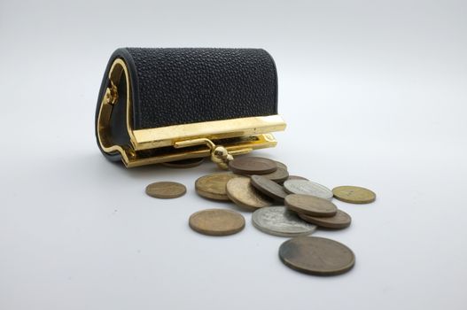 International coins and black wallet, pocket