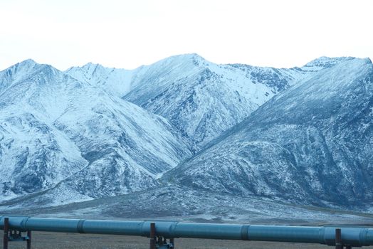 oil pipeline with mountain in northern alaska