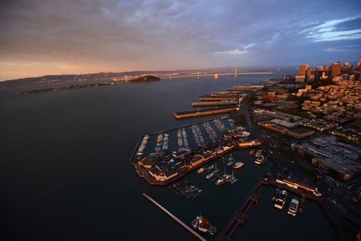 an aerial view of downtown san francisco with pier during sunset