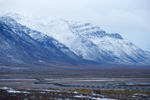 oil pipeline with mountain in northern alaska