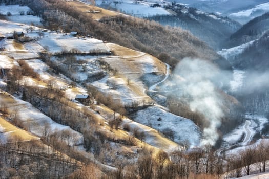 Frozen sunny day of a winter, on wild transylvania hills. Holbav. Romania. Low key, dark background, spot lighting, and rich Old Masters