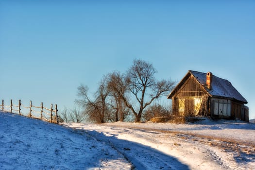 Frozen sunny day of a winter, on wild transylvania hills. Holbav. Romania. Low key, dark background, spot lighting, and rich Old Masters