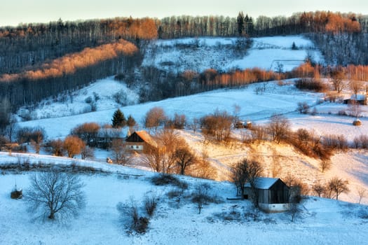 Frozen sunny day of a winter, on wild transylvania hills. Holbav. Romania. Low key, dark background, spot lighting, and rich Old Masters