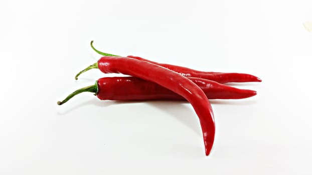 red hot chilies on white background