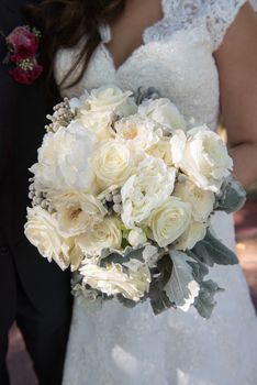 Image of a bride holding her bouquet at a wedding