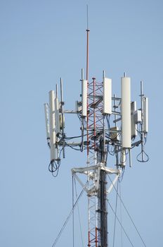 Antenna cellular signal mobile phone tower for telecommunication in blue sky.