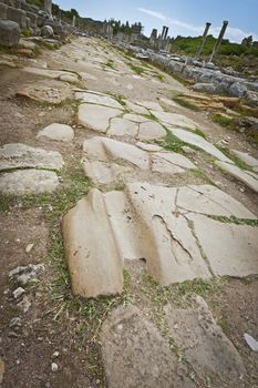 Worn rut from many ancient chariots at historic Perga