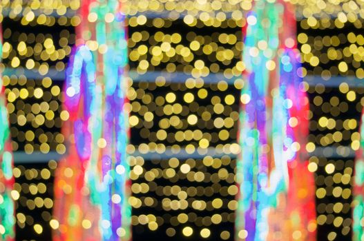 Defocused of glitter or gold and colorful bokeh circle at night as abstract background.