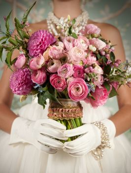 Image closeup of bride holding a beautiful bouquet