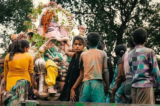 People carrying Hindu God Idol Ganesh for Holy Immersion (Ganpati Visharjan) at The Ganges River, 27 Sep 2015, Kanpur, INDIA