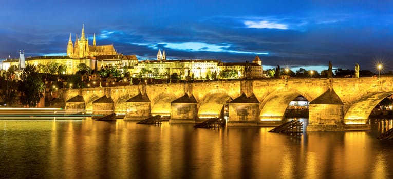 Pargue at dusk, view of the Lesser Bridge Tower of Charles Bridge (Karluv Most) and Prague Castle, Czech Republic.