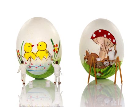 little world painting the eggs for easter
