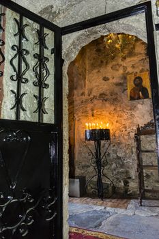 Burning Candles inside a Stoned Monastery