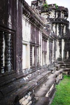 Angkor Wat Cambodia. Khmer ancient Buddhist temple under the picturesque sky with clouds and sunlight. Famous landmark, place of worship in Asia.