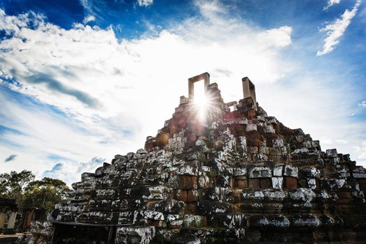 Angkor Wat Cambodia. Khmer ancient Buddhist temple under the picturesque sky with clouds and sunlight. Famous landmark, place of worship in Asia.