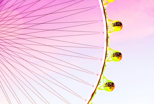 Ferris wheel over the sky in summer