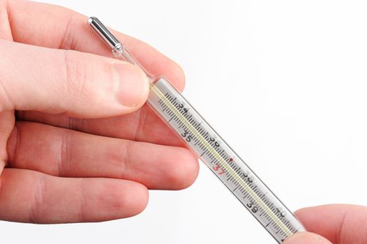 glass thermometer in hand on white background