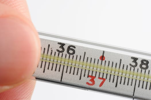 close up of thermometer with 36 and 6 on white