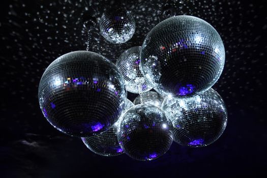 Shiny disco balls on a dark background