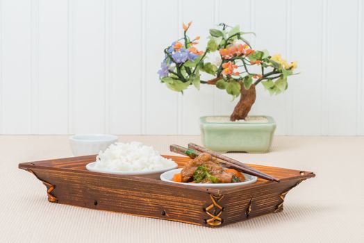 Chinese beef and broccoli served with white rice.