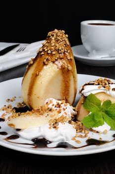 pears with whipped cream sprinkled   nuts,  almonds and chocolate