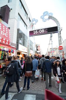 Tokyo, Japan - November 24, 2013: Crowd at Takeshita street Harajuku on November 24, 2013 in Tokyo, Japan. Takeshita street is a street lined with fashion, cafes and restaurants in Harajuku. 