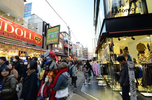 Tokyo, Japan - November 24, 2013: Crowd at Takeshita street Harajuku on November 24, 2013 in Tokyo, Japan. Takeshita street is a street lined with fashion, cafes and restaurants in Harajuku. 