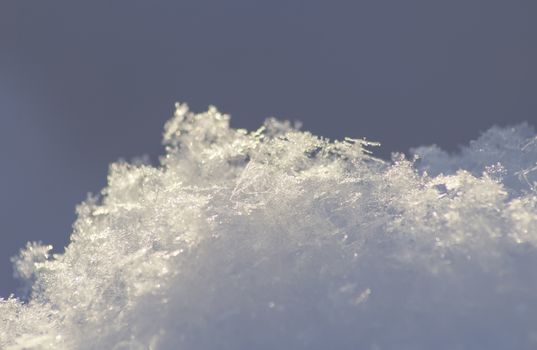 Beautiful icy winter snowflakes during day.