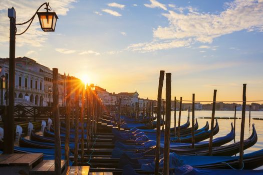 Famous view of Venice with gondolas at sunrise