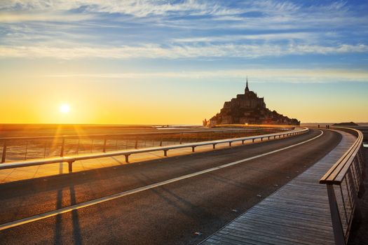 Road to Mont Saint Michel at sunset, Normandy. France.