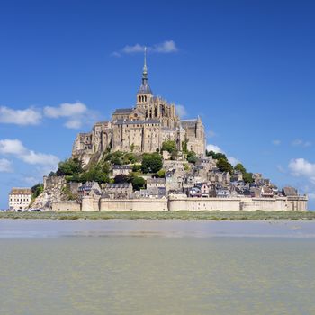 Mont-Saint-Michel with blue sky, France.