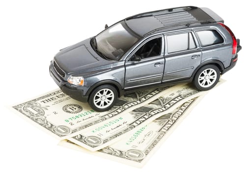 Car on money isolated on white background