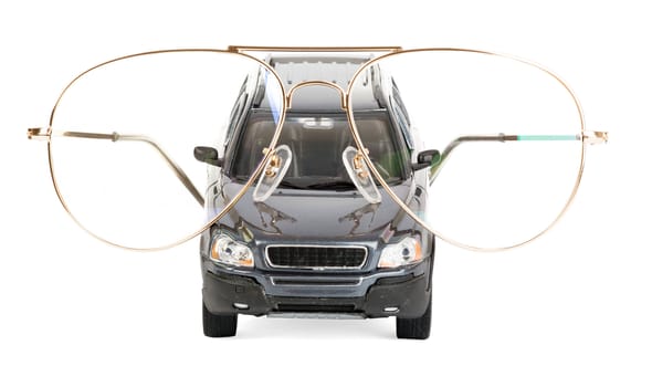 Car with eyeglasses isolated on white background