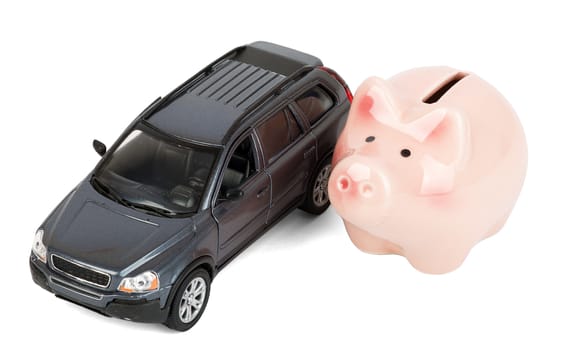Piggy bank with car isolated on white background