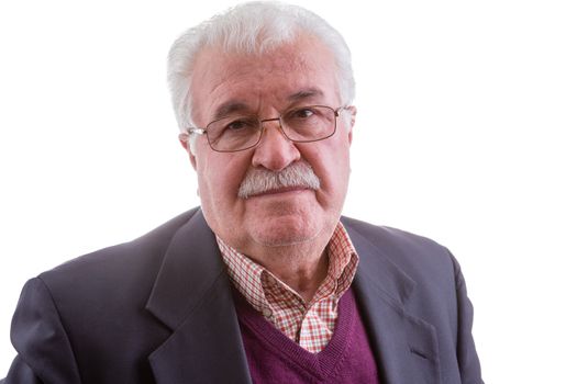 Retired senior man with a troubled contemplative expression gazing directly at the camera, head and shoulders isolated on white