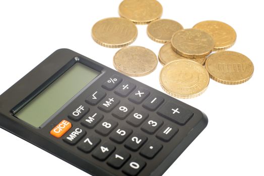 Calculator with coins isolated on white background