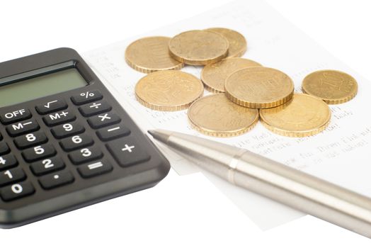 Calculator with coins and pen isolated on white background