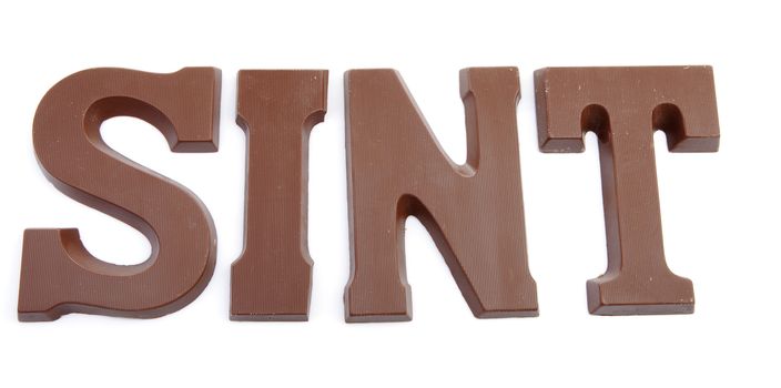 The word "SINT" in chocolate letters isolated on white background, typical Dutch candy for Sinterklaas event in december