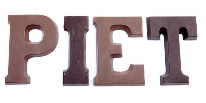 The word "PIET" in chocolate letters isolated on white background, typical Dutch candy for Sinterklaas event in december