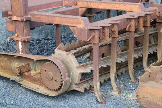 Old and rusty machinery.
Old agricultural machinery long past it's working life.