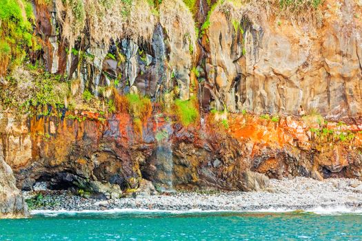 Colorful rocky cliff coast of Madeira between Jardim do Mar and Calheta