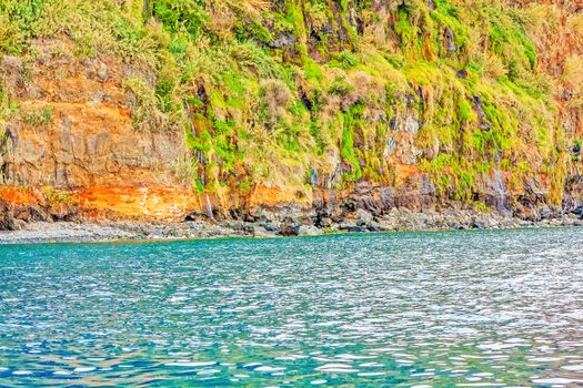 Colorful rocky cliff coast of Madeira between Jardim do Mar and Calheta