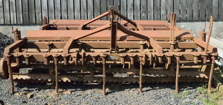 Old and rusty machinery.
Old agricultural machinery long past it's working life.