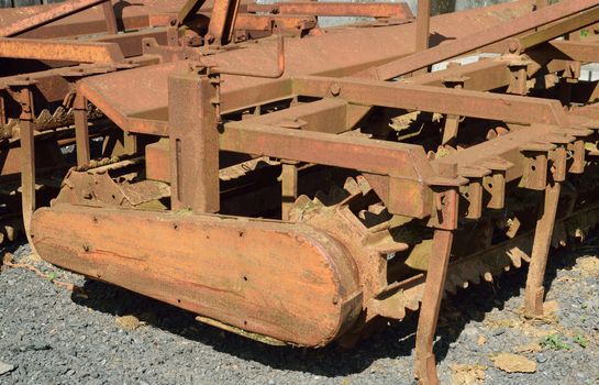 Old and rusty machinery.
Old agricultural machinery long past it's working life.