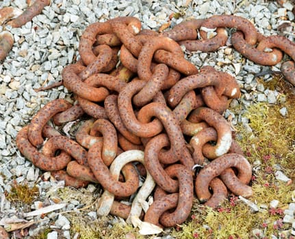 Chain in situ.

Old rusted and quite large linked chain used in a sculptural way in a landscape.