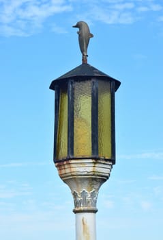 Dolphin topped old street lampshade.
Imaginative use of old street light.