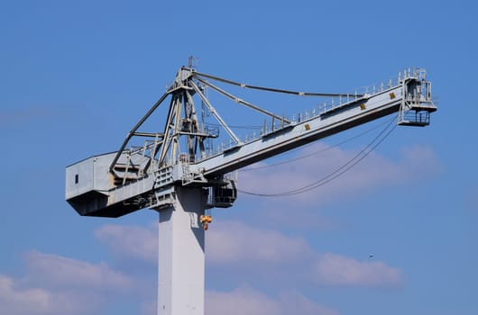 Large crane in Devonport dock. Near to Plymouth in Devon UK, the navy dockyards are home to many industries and the sight of this monster is an everyday sight to the locals.