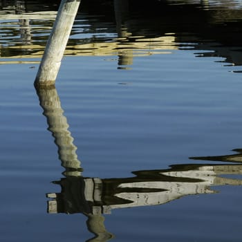                                 
Ripples and Reflections.

Calm day at the moorings on the lake.